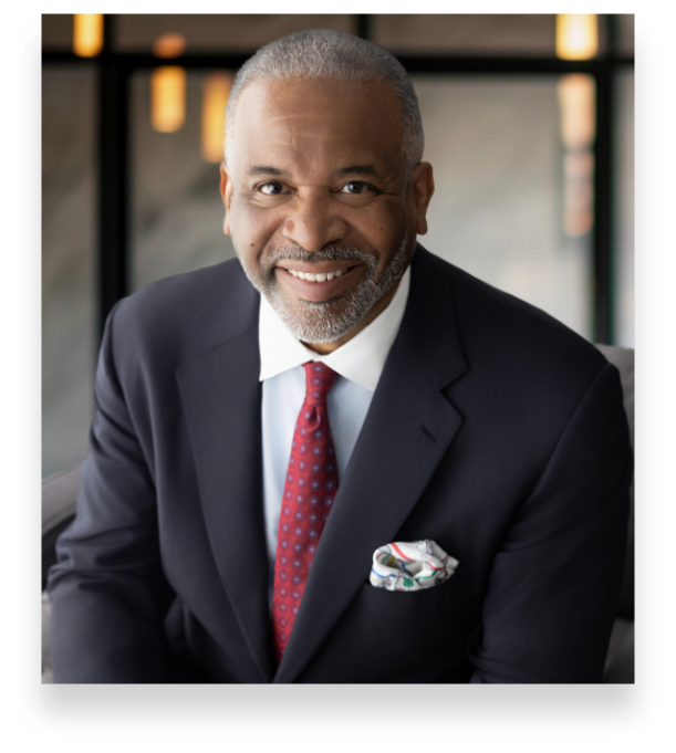 Dr. Gregory J. Vincent, seated in a chair facing the camera smiling and approachable facial expression
